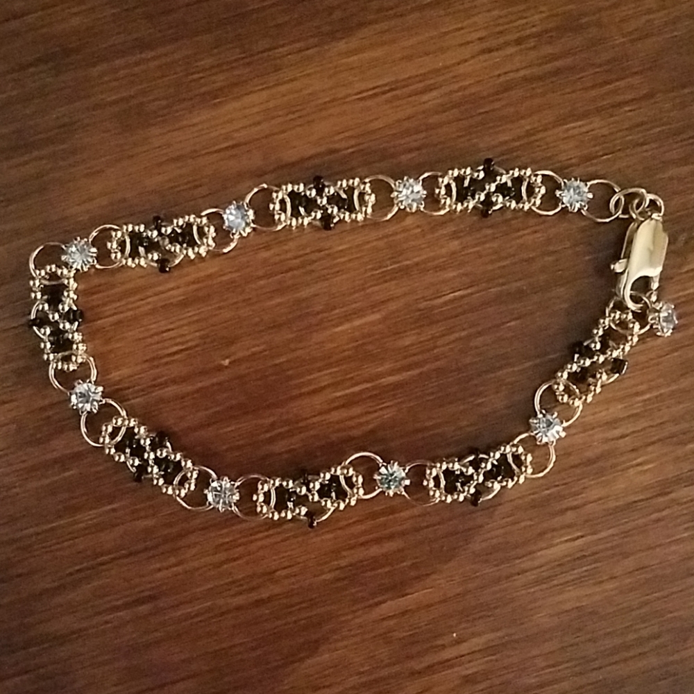 BEAUTIFUL New gold, black  & clear gem bracelet